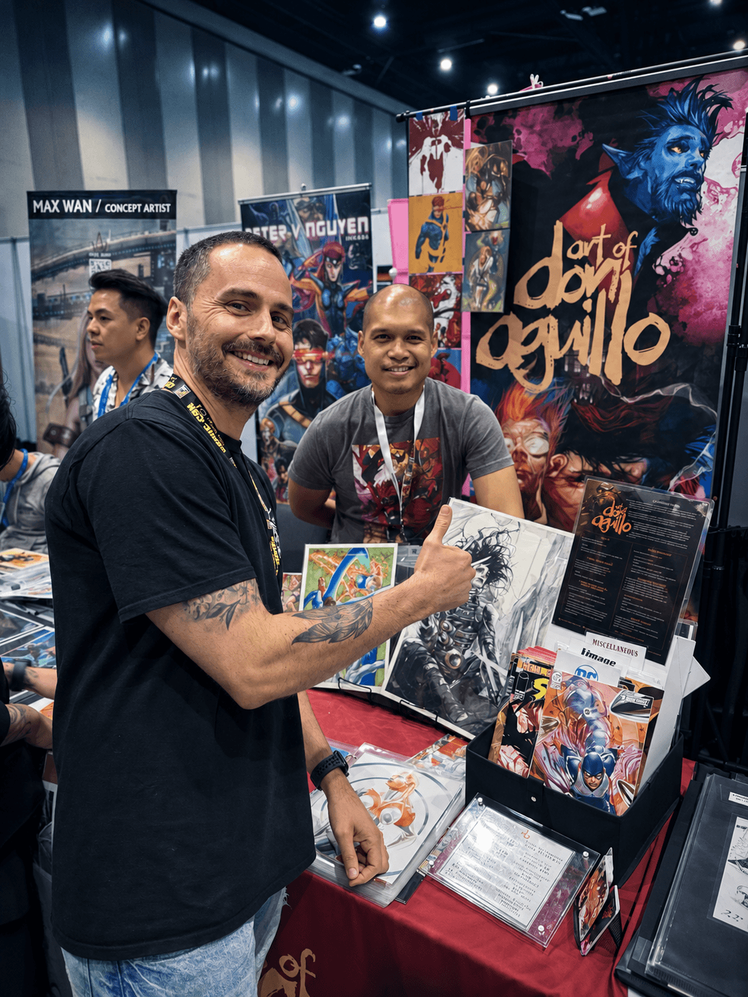 James at a comic-art stall with prints and posters.